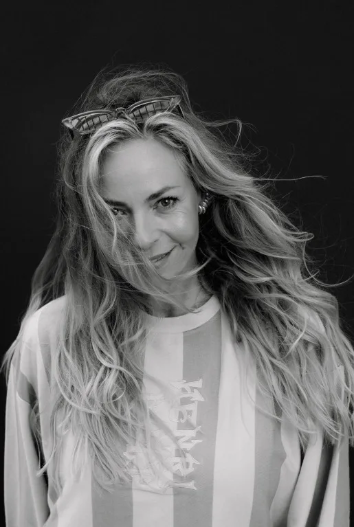 DJ RICHÈL - black and white picture of her standig and facing the camera.